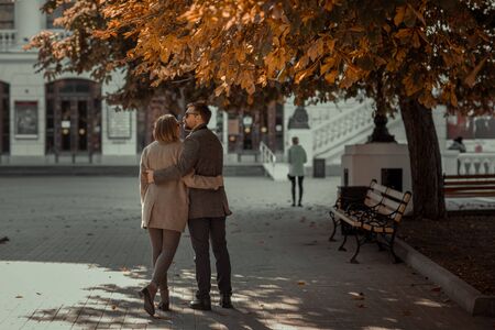 The pair of lovers cuddle and hold hands during a romantic outing.の写真素材