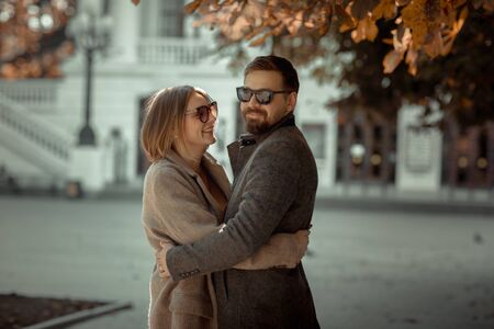 The pair of lovers cuddle and hold hands during a romantic outing.の写真素材