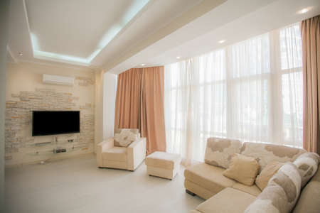 The interior of a modern apartment after renovation. Presentation of the apartment in light warm tonesの写真素材
