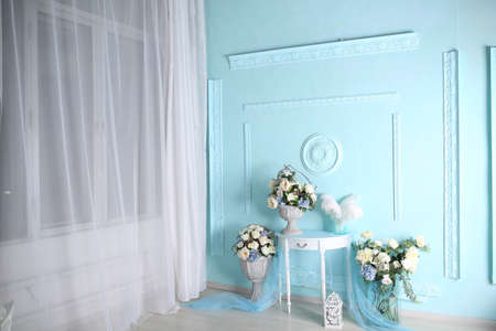 Decorations in the room in a soft blue shade gifts and flowersの写真素材