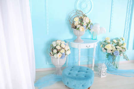 Decorations in the room in a soft blue shade gifts and flowersの写真素材