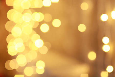 Blurred lights of holiday bulbs or sparklersの写真素材