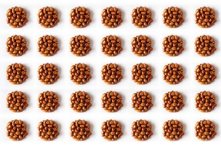 Pattern of healthy natural sweetness of kozinaki are prepared from peanuts, honey and molasses,...