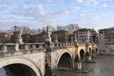 Sant Angelo bridge over the Tiber river, Rome, Italy, buildings, trees, blue sky, sunset, spring, Aliev bridge, architectureの写真素材