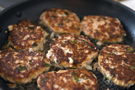 meat burgers cutlets with brown crust are fried on a frying pan, cooking, food, recipe