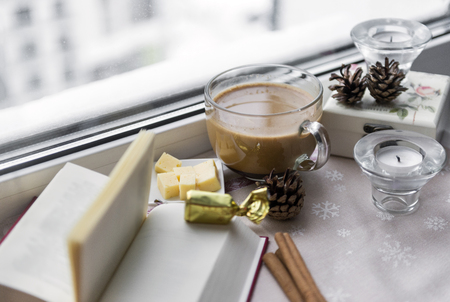 1 mug, coffee, coffee with milk, book, cones, candles, cinnamon, cheese, window, hot drink, window sill, still life, food, candyの写真素材