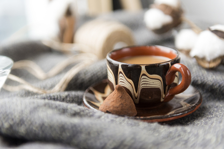 hot drink, Cup of coffee with candy on knitted fabric,の写真素材