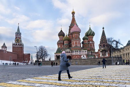 Moscow, red square in winter, St. Basil's Cathedral, the Kremlin, people walk, pedestrian crossingの写真素材