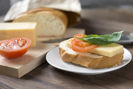 sandwich of fresh loaf, cheese, tomato and Basil, bread, snack