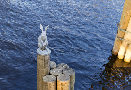 landmark, metal hare sitting on wooden stilts in the middle of the Neva river in St. Petersburg, attractionの写真素材