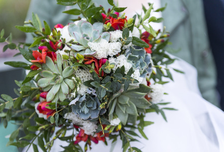 green Bridal bouquet with succulents, bouquet of flowers, wedding bouquet on a light backgroundの写真素材