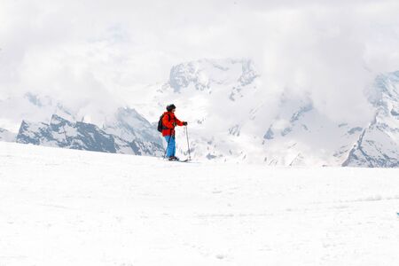 child skiing on a snowy mountain slope, Caucasus, people, skiers,