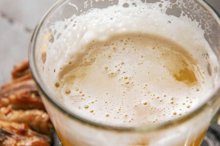light beer mug with foam top view, alcoholic beverage, drink