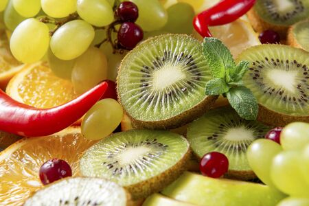  kiwi,  green grapes,  Apple slices, cranberries, orange , chili pepper, mint , fresh citrus, の写真素材