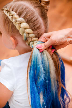 blonde girl braids with blue hair, beautiful hairstyleの写真素材