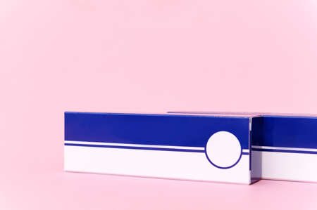 Two white and blue rectangles on pink background horizontal copy space medicineの写真素材