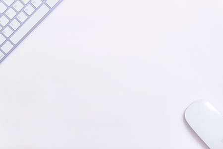 Keyboard purple keys white table central copy space mouse work office studyの写真素材