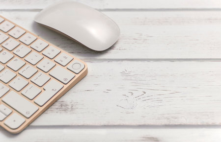 Keyboard yellow keys white wooden background angle copy space mouse work office study
