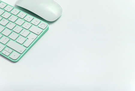 Keyboard green keys white background angle copy space mouse work office studyの写真素材