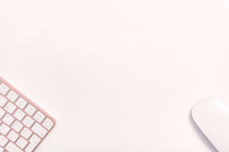 Keyboard pink keys white table angle copy space mouse work office studyの写真素材