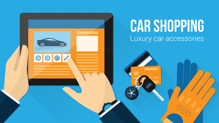 Car accessories shopping banner, man searching for tires on a website using a tablet with car keys, driving gloves and credit cardsのイラスト素材