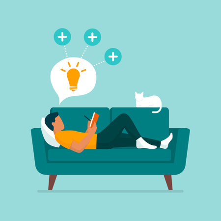 Creative man lying on the couch at home, he is reading and writing on a notebookのイラスト素材