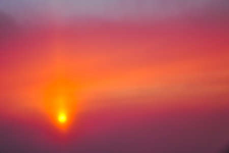Beautiful dawn with orange and pink clouds. View from the plane.