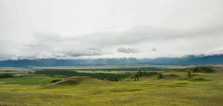 Altai mountains landscape. The mountain range behind the steppe and hillsの写真素材