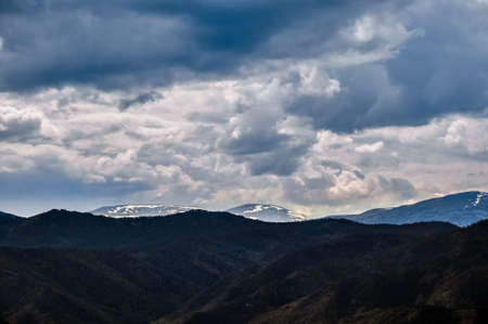 Cloudy snow covered mountain peak. Altai, Russia.の写真素材