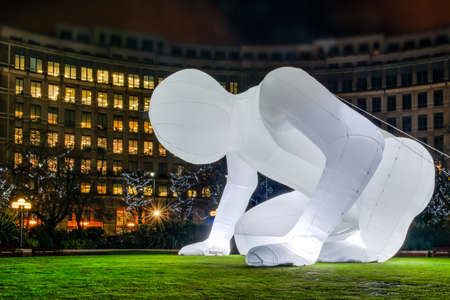 London, United Kingdom - January 11, 2016: Winter Lights Festival at Canary Wharf, Docklands. "Fantastic planet" installation by Amanda Parer. It shows a giant inflatable alien figure who just landed and is exploring our planet.のeditorial素材