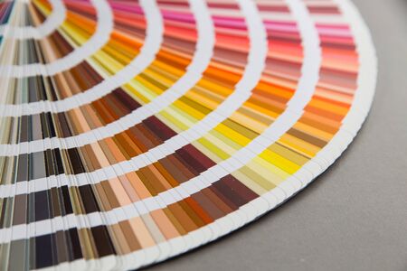 multicolored strips of paper spread out in a fanの写真素材