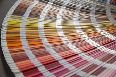 multicolored strips of paper spread out in a fanの写真素材