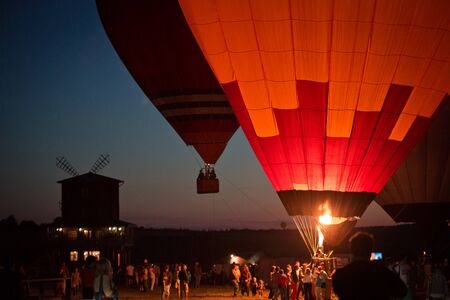 balloons in the evening on the background of the mill