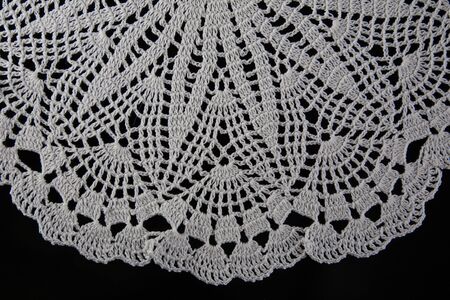 white lace on black background, crochet