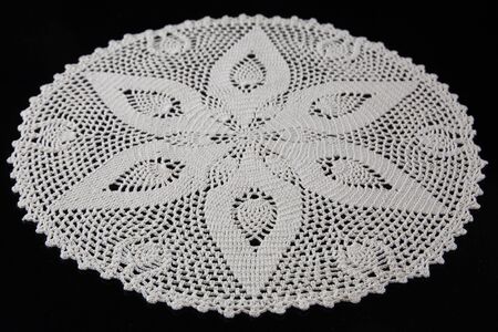 white lace on black background, crochetの写真素材