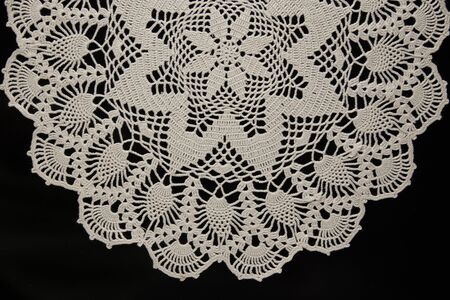white lace on black background, crochetの写真素材