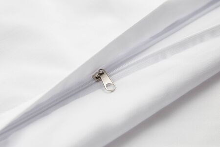zipper on white cotton product, bed linenの写真素材
