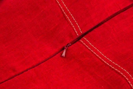 hidden plastic zipper in a product made of red linen fabricの写真素材
