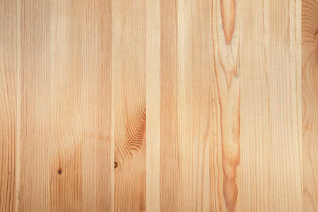 background of unpainted wooden boards of yellow color, natural texture