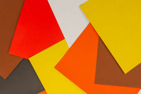 multi-colored sheets of rectangular paper, spread out on a planeの写真素材