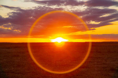 solar halo at sunset on the background of clouds, summer landscape