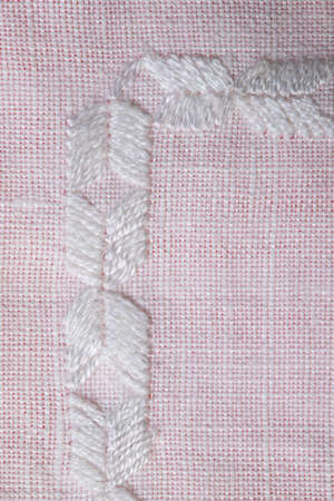 hand embroidery on linen and cotton fabric, homespun cloth, Richelieu and mesh, backgroundの写真素材
