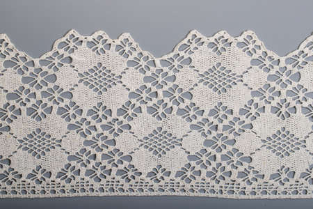 hand embroidery on linen and cotton fabric, homespun cloth, Richelieu and mesh, backgroundの写真素材
