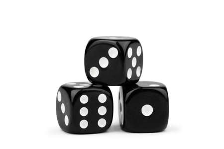 black dice with contrasting dots, isolate on a white backgroundの写真素材