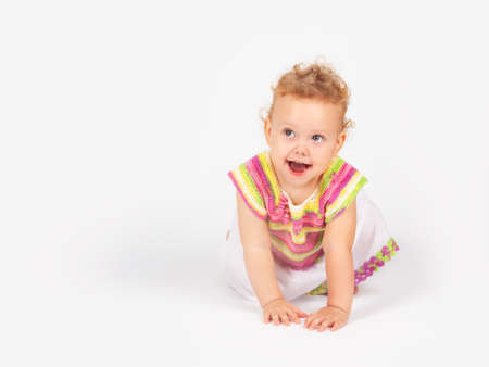 little girl with curly hair on a light background