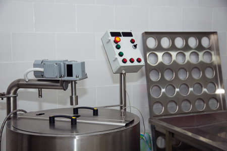 equipment of a private cheese factory and stages of preparation and productionの写真素材