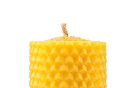 handmade candle made of natural beeswax, isolate on a white backgroundの写真素材
