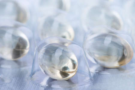 packaging of capsules with medicine or vitamins in a silver blister