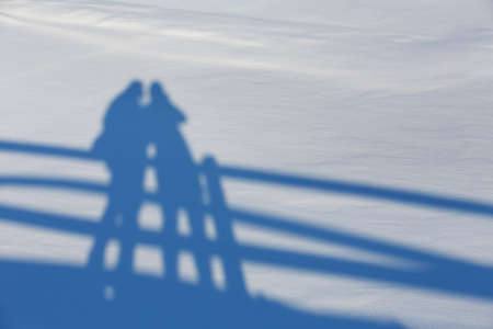 blue contrasting shadows on white snow on a bright sunny day, background