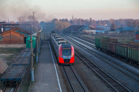 SHUYA, RUSSIA-APRIL 29, 2018: provincial railway station, arriving train, spring eveningのeditorial素材